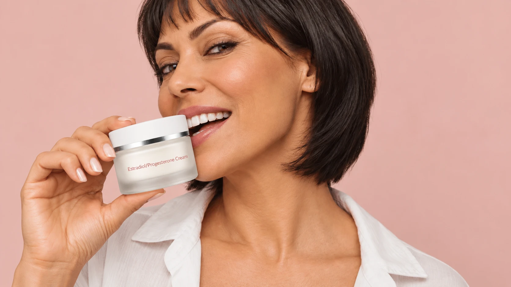 Woman holding prescription estradiol & progesterone cream